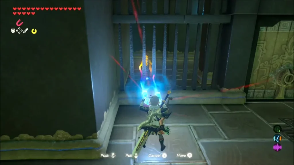Link using Magnesis to lift a key behind iron bars Link using Magnesis to lift a key behind iron bars