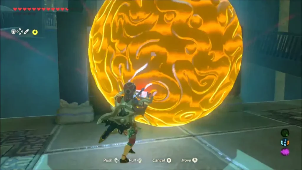 Link using Magnesis to push a large glowing boulder up the slope ahead of him Link using Magnesis to push a large glowing boulder up the slope ahead of him