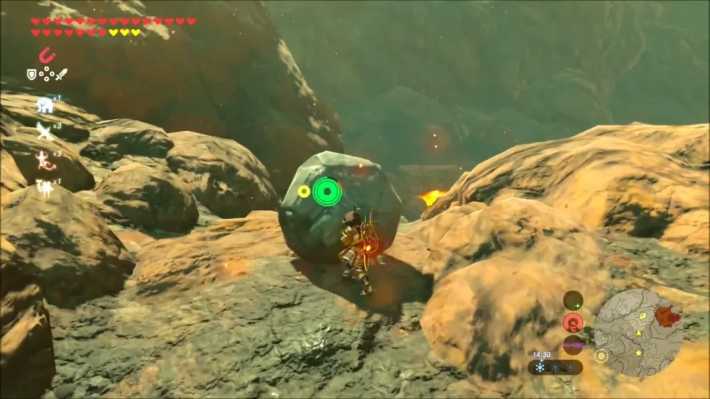 Link pushing a round boulder on a rocky ledge Link pushing a round boulder on a rocky ledge