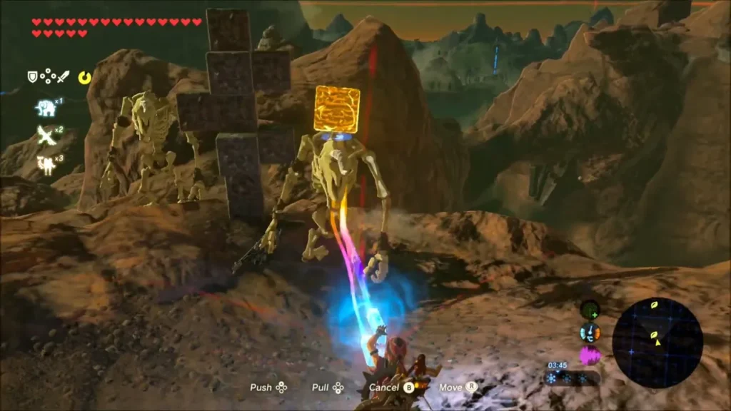 Link using Magnesis on a gold block beside stacked stones as two Stalfos stand nearby Link using Magnesis on a gold block beside stacked stones as two Stalfos stand nearby