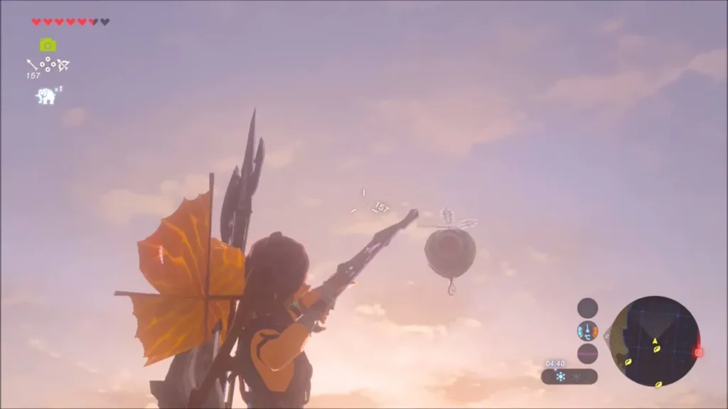 Link at sunset aiming the bow up at a floating balloon above the ridge