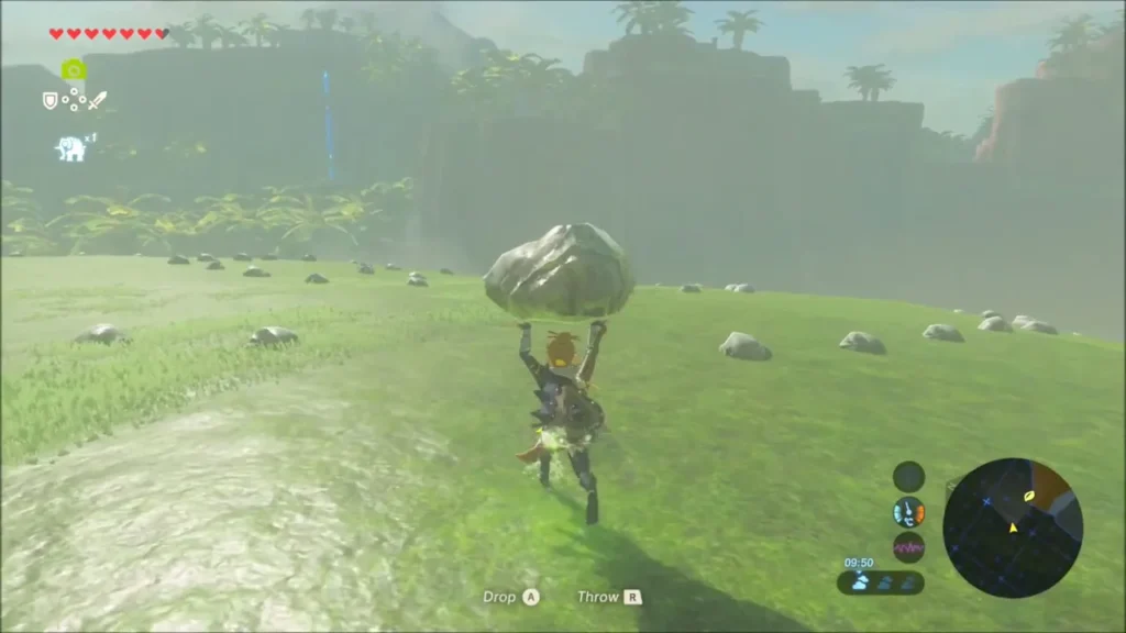 Link carrying a rock across the grassy slope dotted with small stones