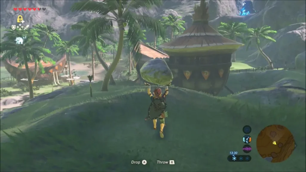 Link carrying a boulder up the hill toward the round village hut