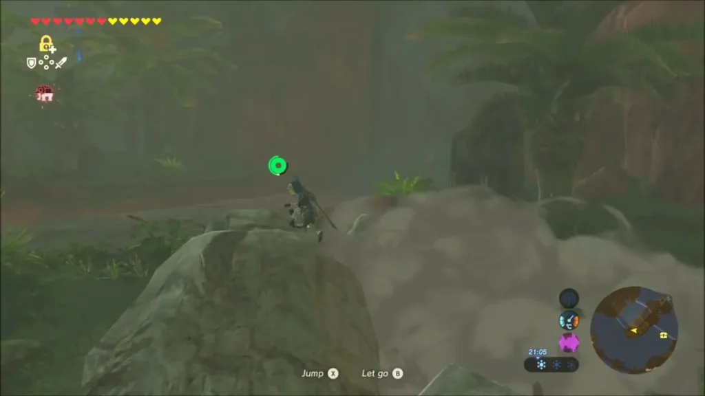 Link climbing the boulder pile beside Lake Floria toward the Stone Talus