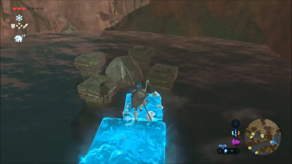 Link standing on a Cryonis ice block crossing the pool toward stone ruins