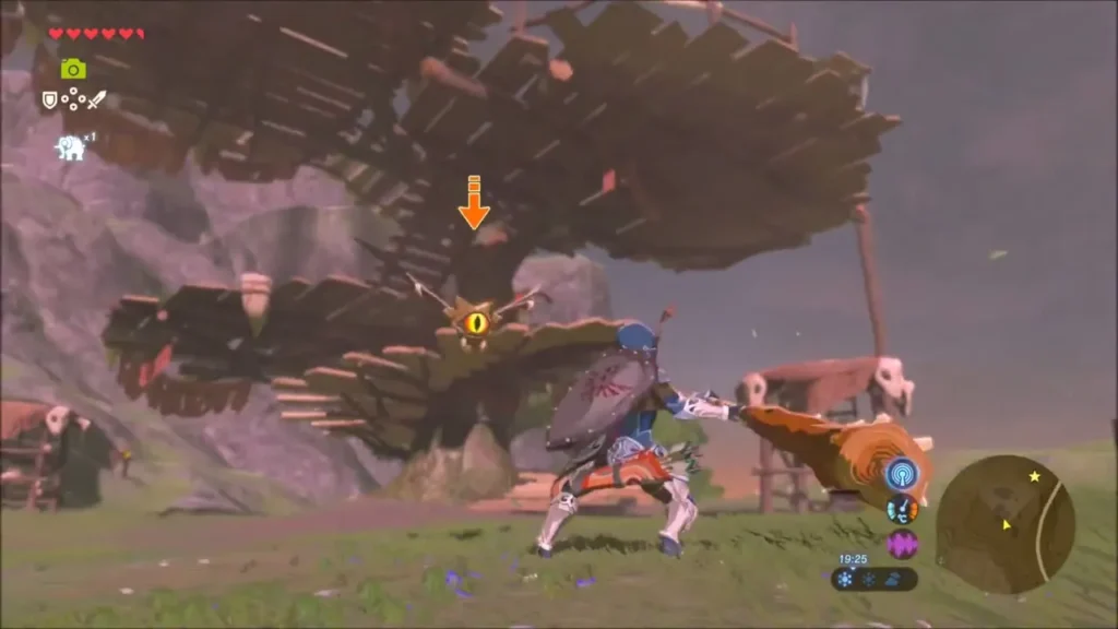 Link swinging a club under the wooden platforms of the camp