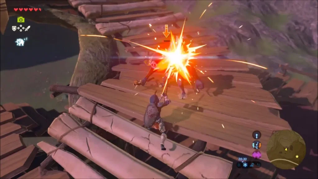 Link striking a Bokoblin on the wooden planks