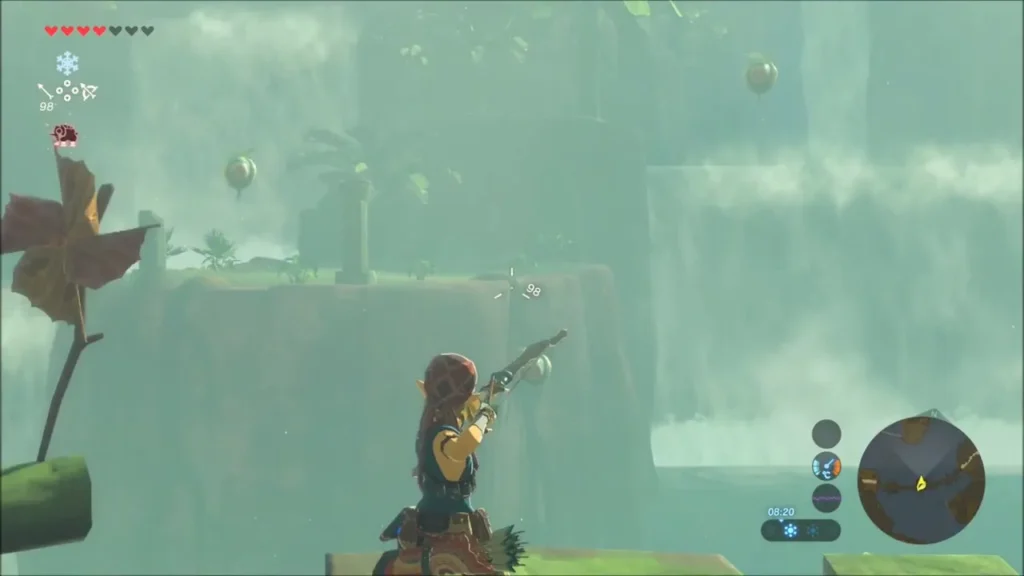 Link aiming his bow at green pods floating in front of the falls