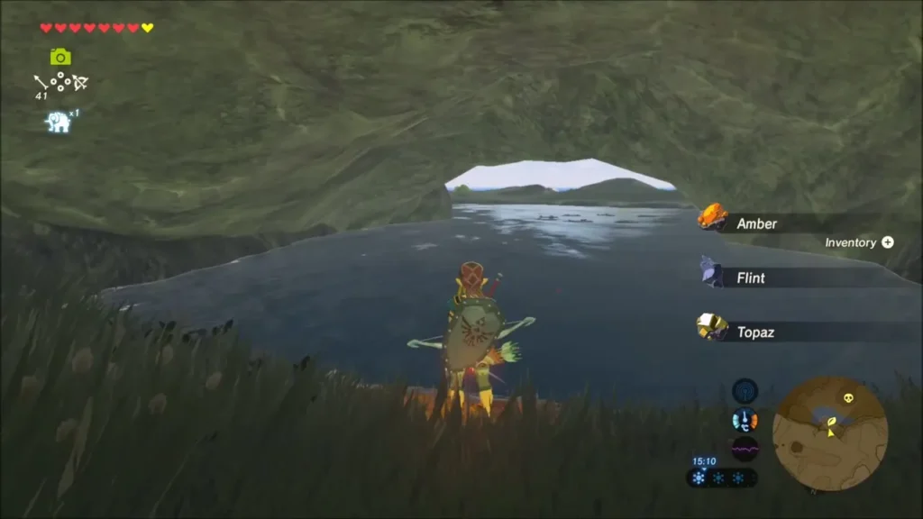 Link collecting Amber, Flint and Topaz from ore in a rocky cove
