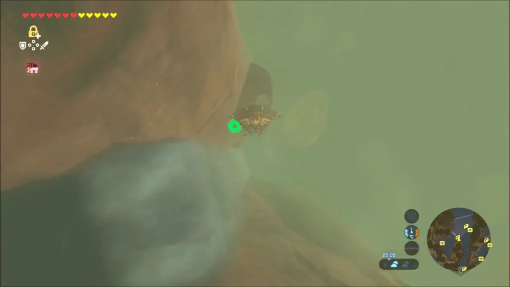 Link gliding down the red cliff face toward a narrow ledge