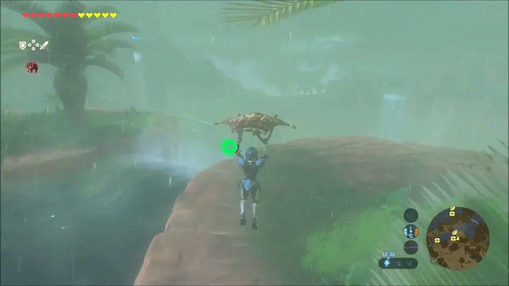 Link gliding toward a cliff ledge beside a waterfall