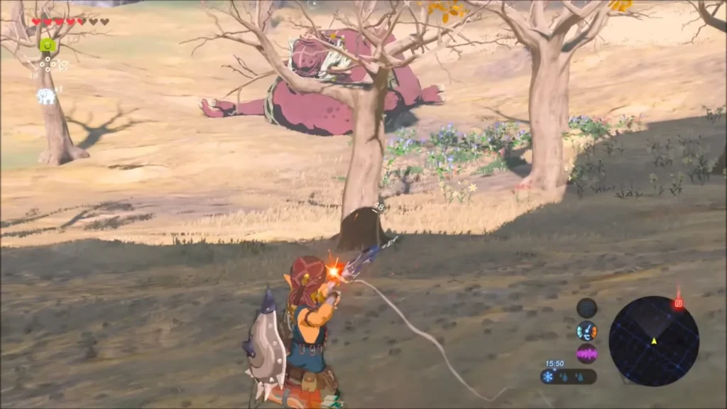 Link aiming a bow at a sleeping Hinox on a dry plain of bare trees