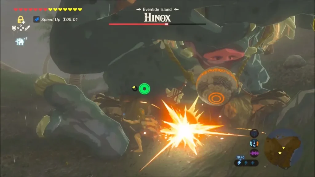 Link striking the Hinox's orb-bearing eye area while it is down