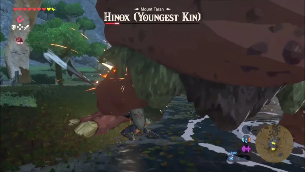 Link slashing the Youngest Kin's leg in the shallows
