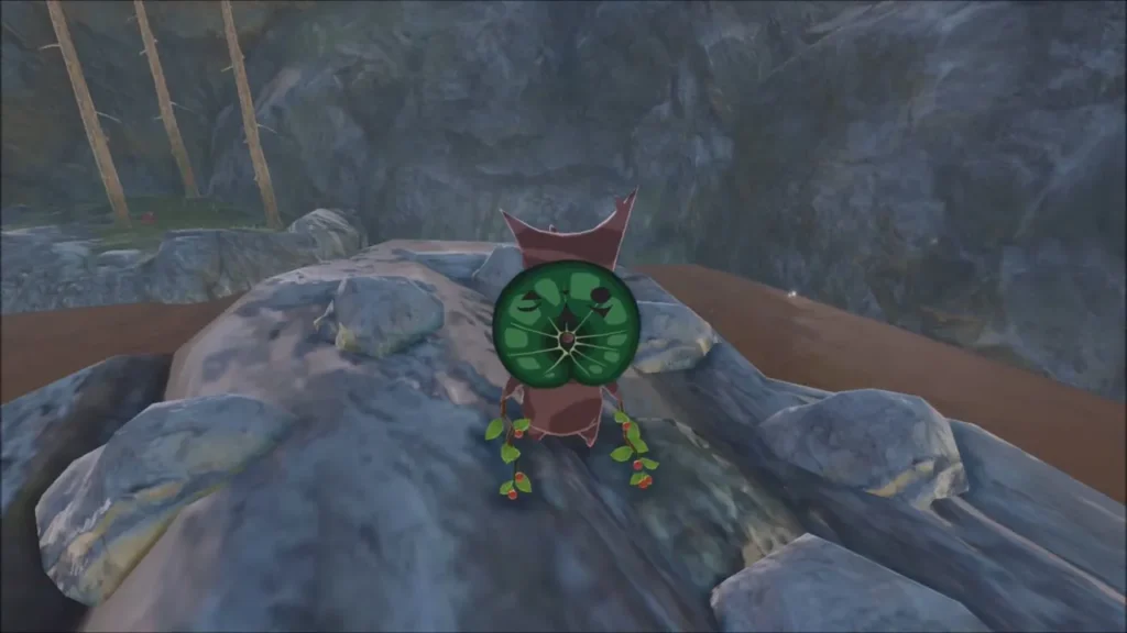 A green Korok revealed on top of the rock spire