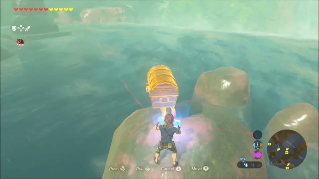Link pulling a chest across a rocky island with Magnesis