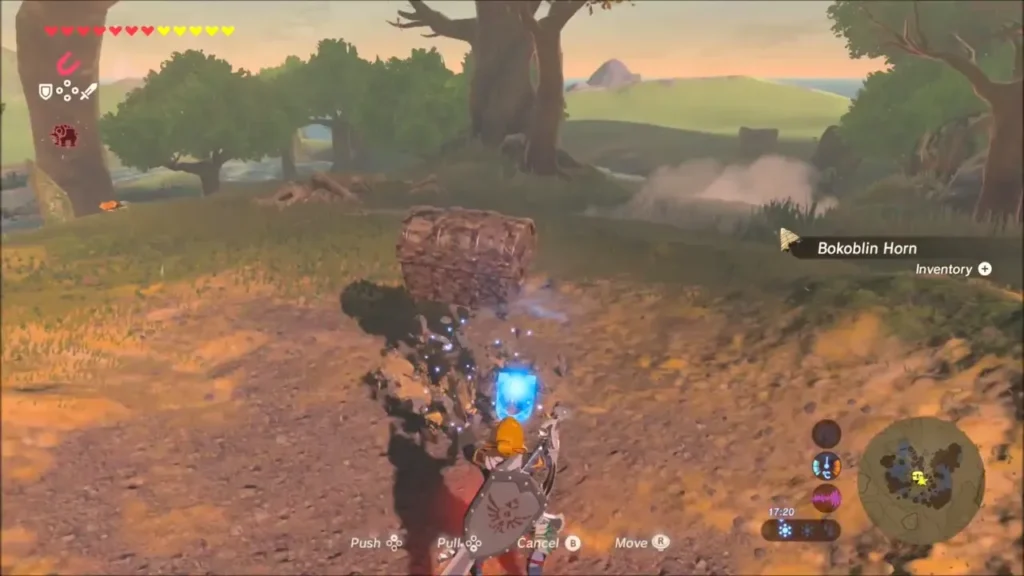 Link pulling the chest free with Magnesis