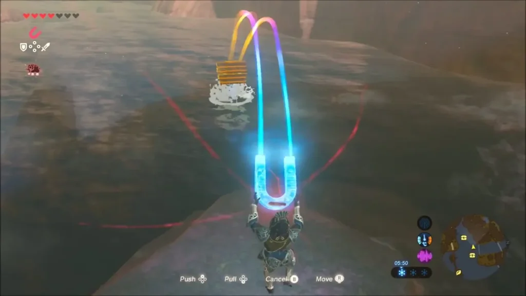 Link using Magnesis to pull a metal chest out of the lake