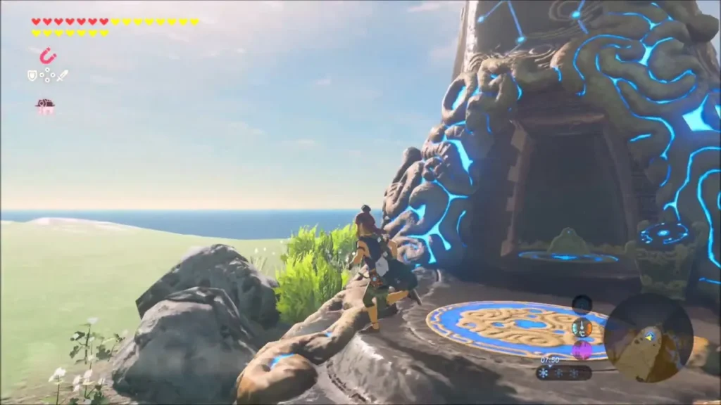 Link beside the glowing Muwo Jeem Shrine entrance above the sea