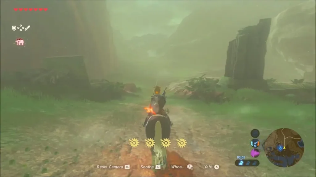 Link riding east along the dirt road past rock pillars