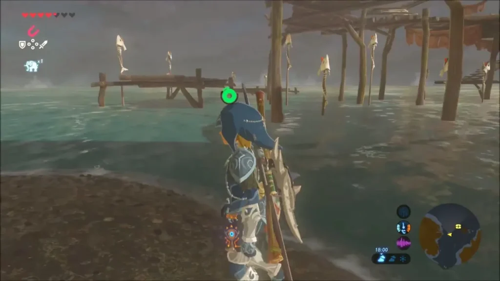Link walking the shore toward the spit below the boardwalk camp