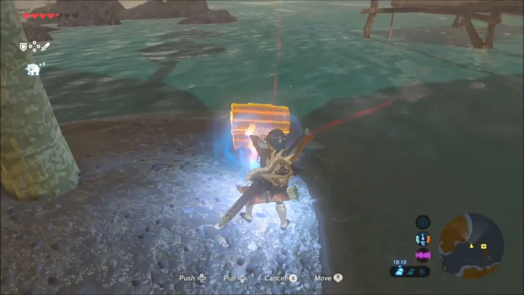 Link using Magnesis to lift the chest on the shore spit