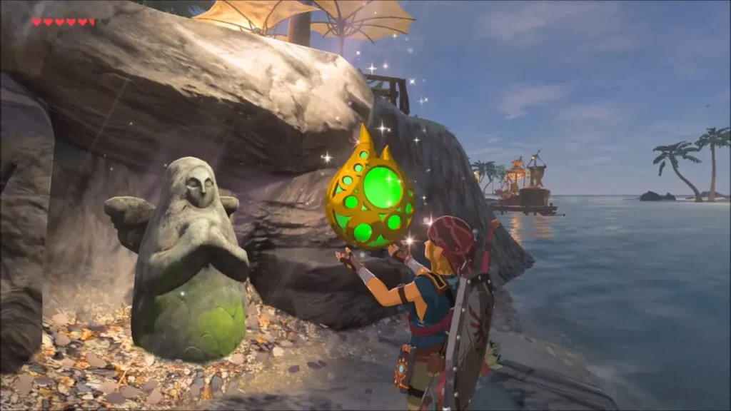 Link holding up a Stamina Vessel beside the Goddess Statue