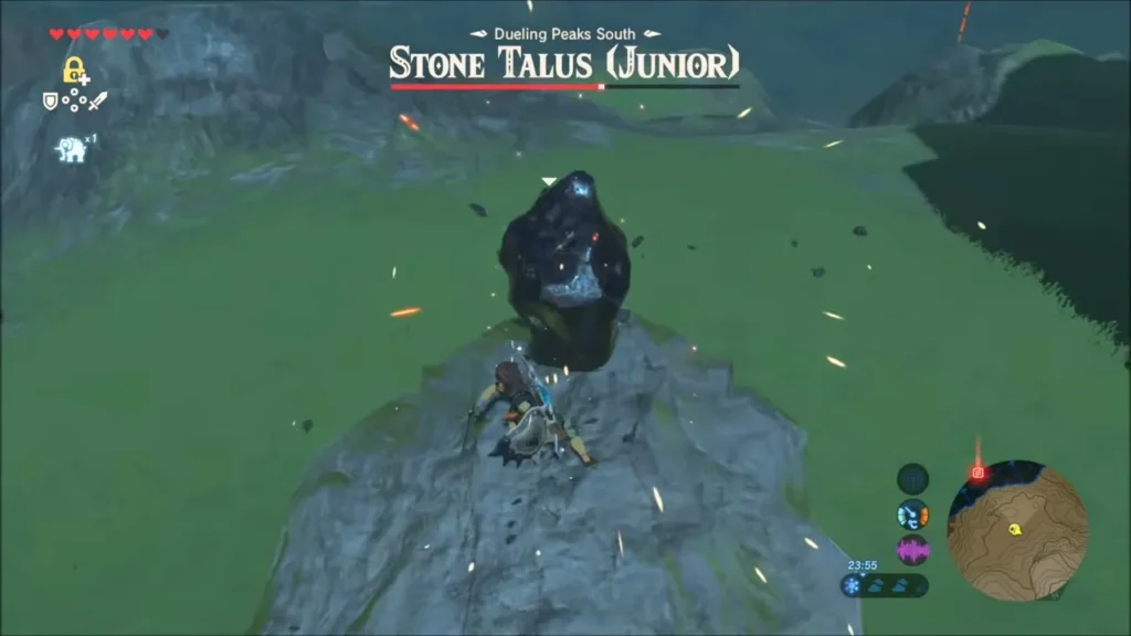 Link on the back of the Stone Talus (Junior) striking the dark ore deposit