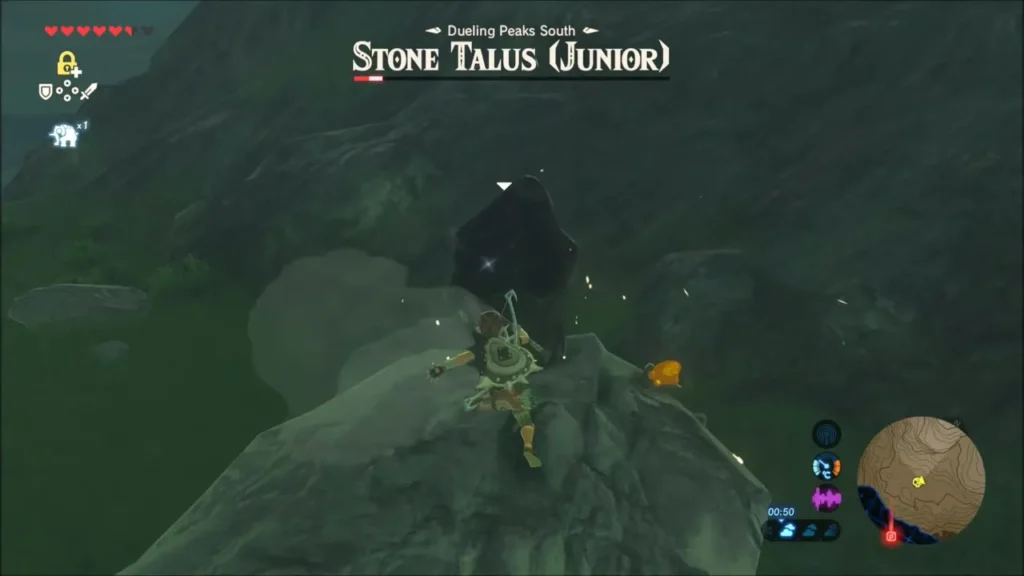 Link hitting the ore on the Stone Talus's back as an Amber drops beside it