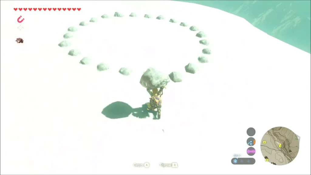 Link holding a boulder before a ring of stones with a gap Link holding a boulder before a ring of stones with a gap