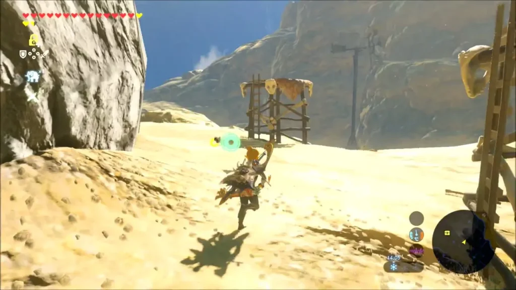 Link running toward the Bokoblin camp, a wooden lookout tower with skulls ahead Link running toward the Bokoblin camp, a wooden lookout tower with skulls ahead