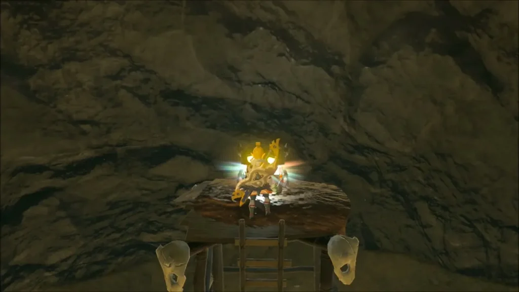A glowing chest on a wooden platform inside the small cave beside the camp A glowing chest on a wooden platform inside the small cave beside the camp