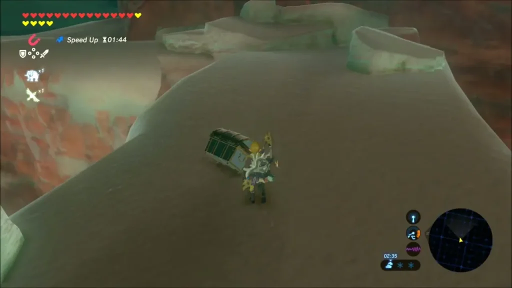 Link beside the pulled-out chest on a red rock ledge Link beside the pulled-out chest on a red rock ledge