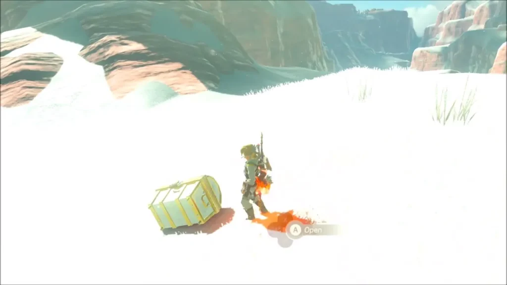 Link standing next to a chest on the snowfield ready to open it Link standing next to a chest on the snowfield ready to open it