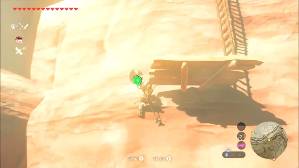 Link hanging on the cliff below the top platform with a ladder above Link hanging on the cliff below the top platform with a ladder above