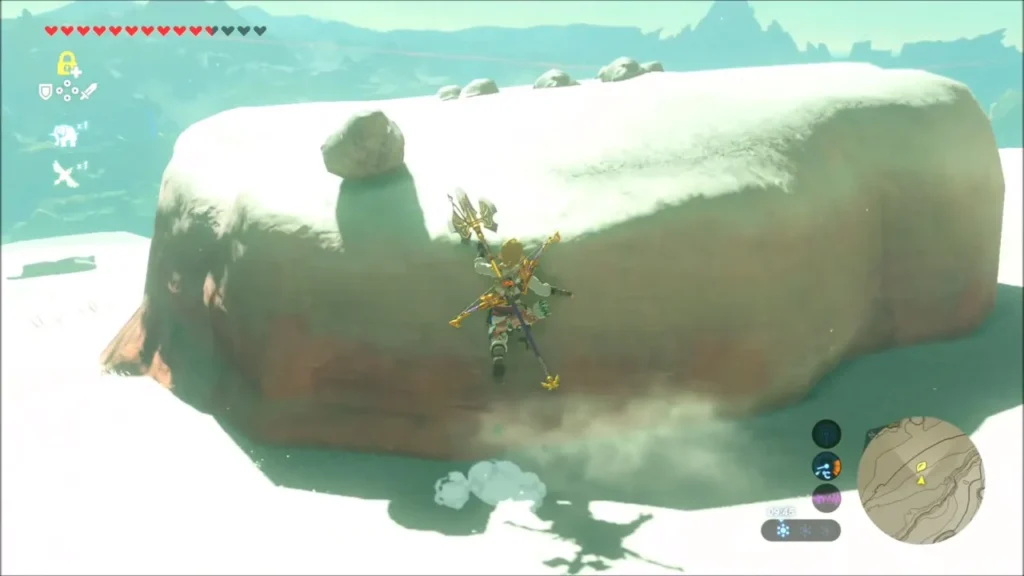 Link climbing the snowy red boulder Link climbing the snowy red boulder