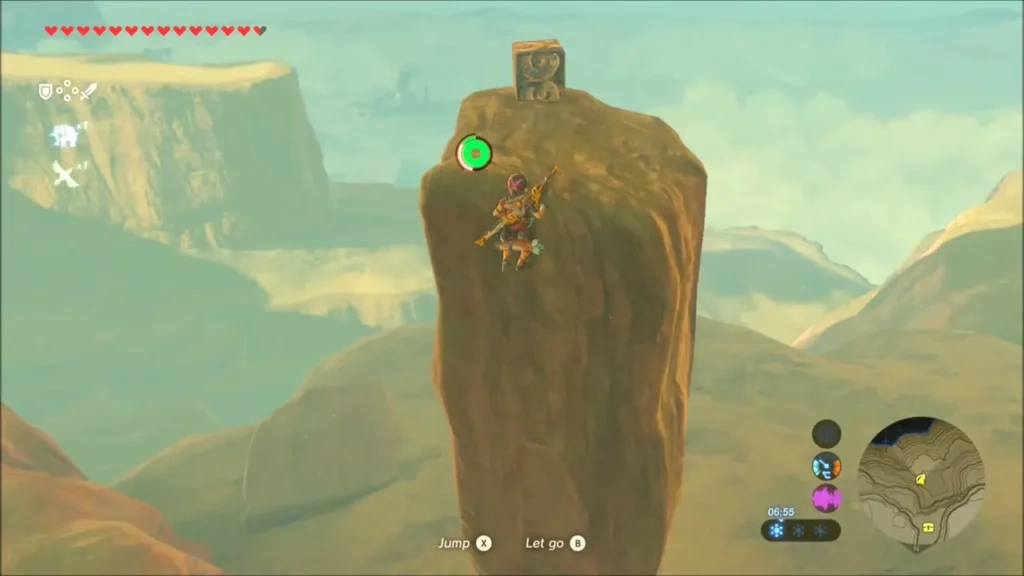 Link climbing a tall rock pillar with a metal cube resting on top Link climbing a tall rock pillar with a metal cube resting on top