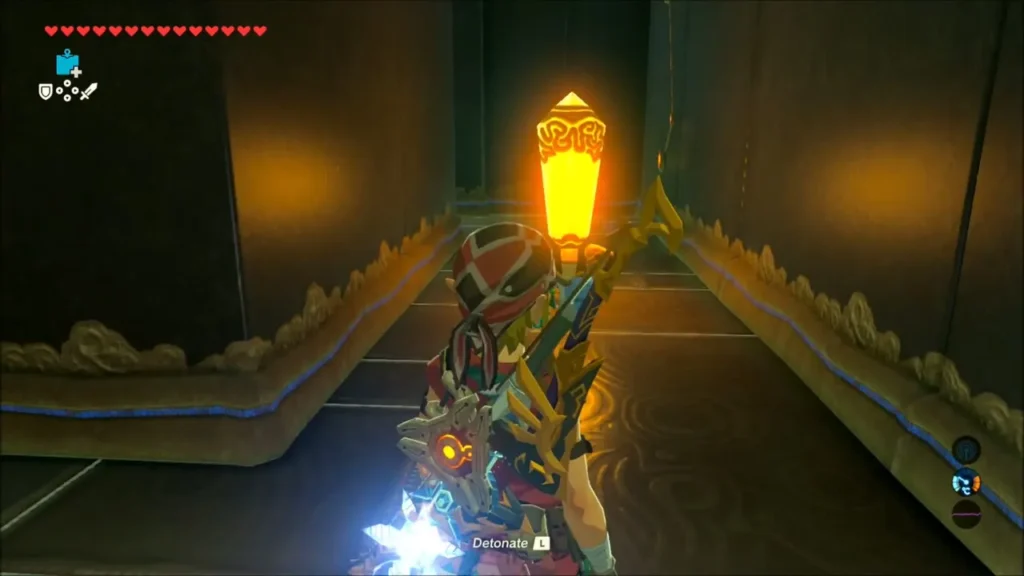 Link holding a round bomb with the Detonate prompt in the shrine corridor Link holding a round bomb with the Detonate prompt in the shrine corridor