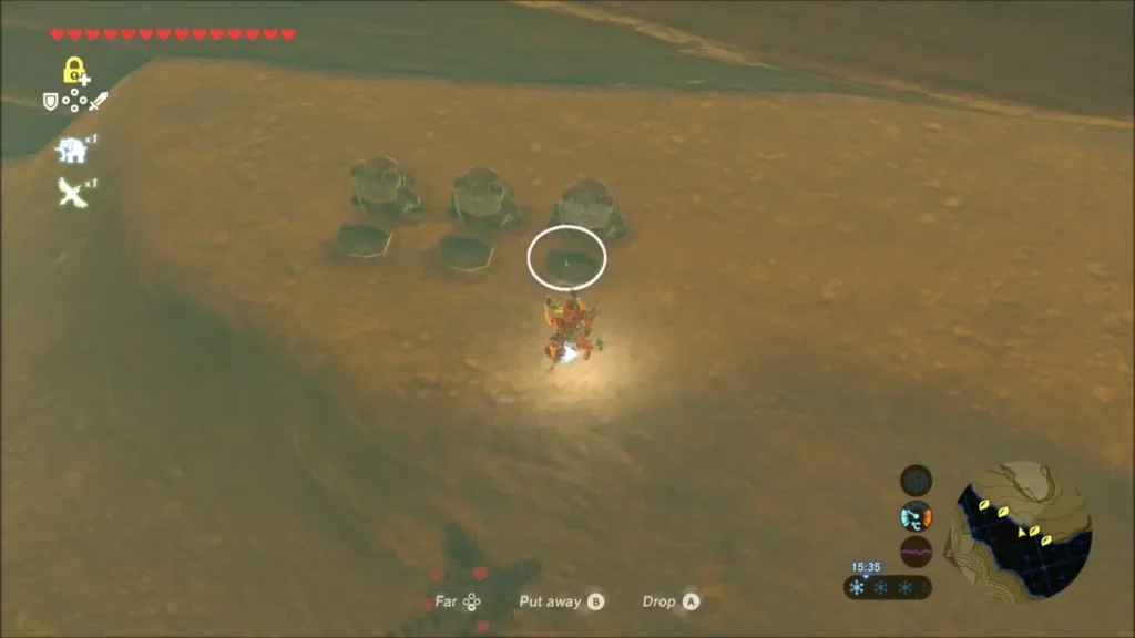 Link carrying a stone above a row of empty round sockets along a desert wall Link carrying a stone above a row of empty round sockets along a desert wall