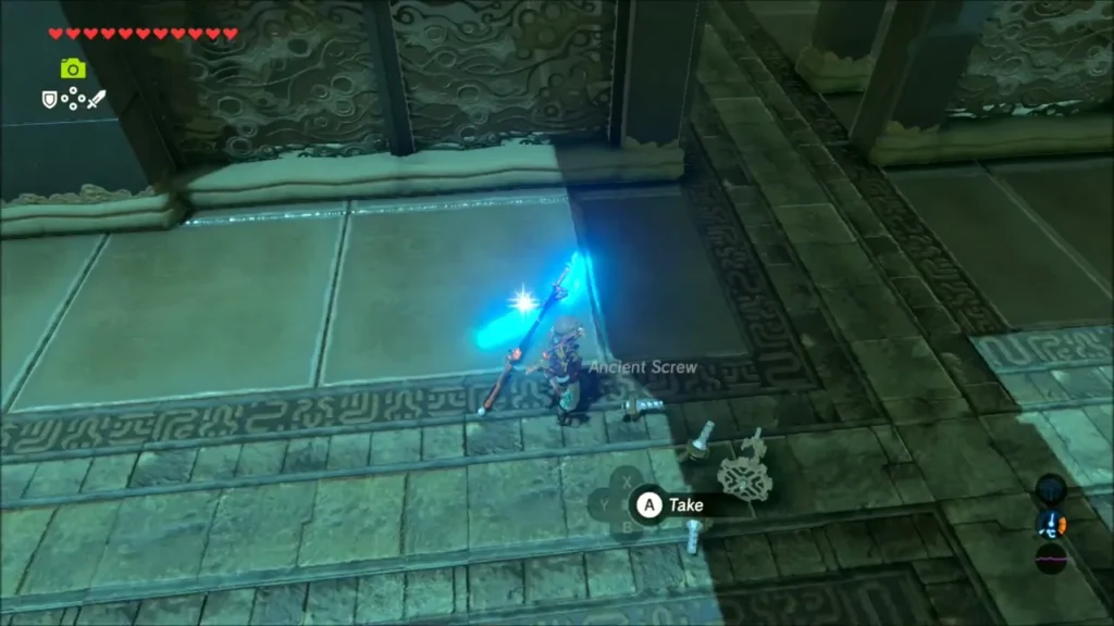 Link at a fallen Guardian's parts with the Ancient Screw ready to take Link at a fallen Guardian's parts with the Ancient Screw ready to take