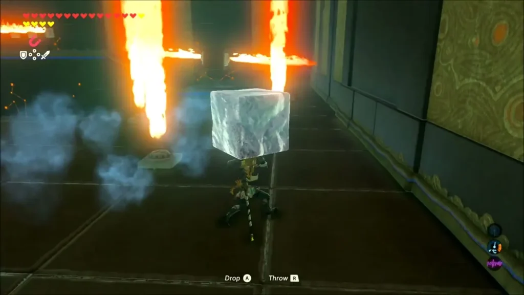 Link carrying a block of ice past towering columns of fire in Kuh Takkar Shrine Link carrying a block of ice past towering columns of fire in Kuh Takkar Shrine