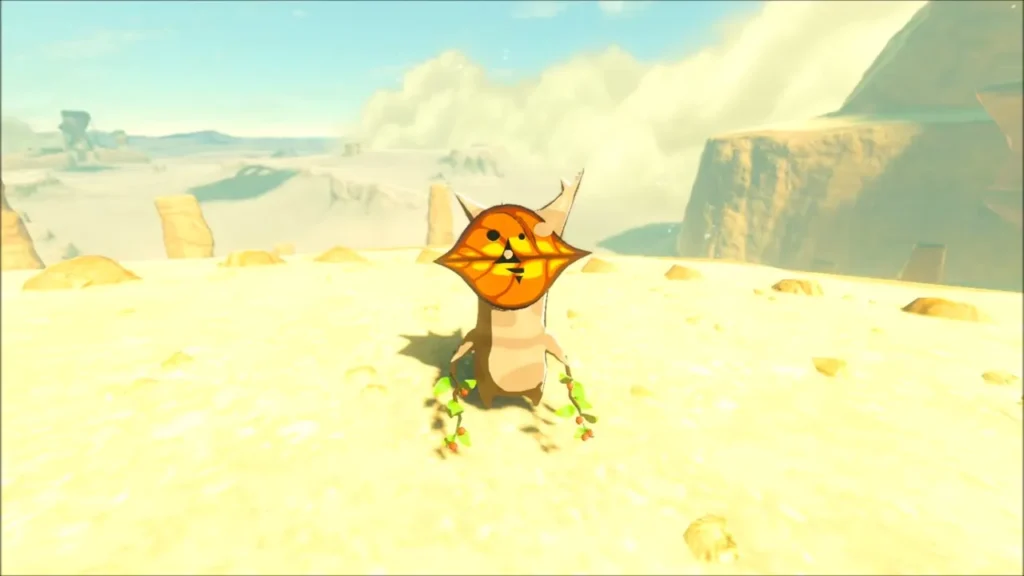 A Korok standing on the pale sand of the canyon floor A Korok standing on the pale sand of the canyon floor