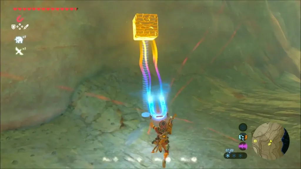 Link using Magnesis to lift a metal cube through a rocky gully Link using Magnesis to lift a metal cube through a rocky gully