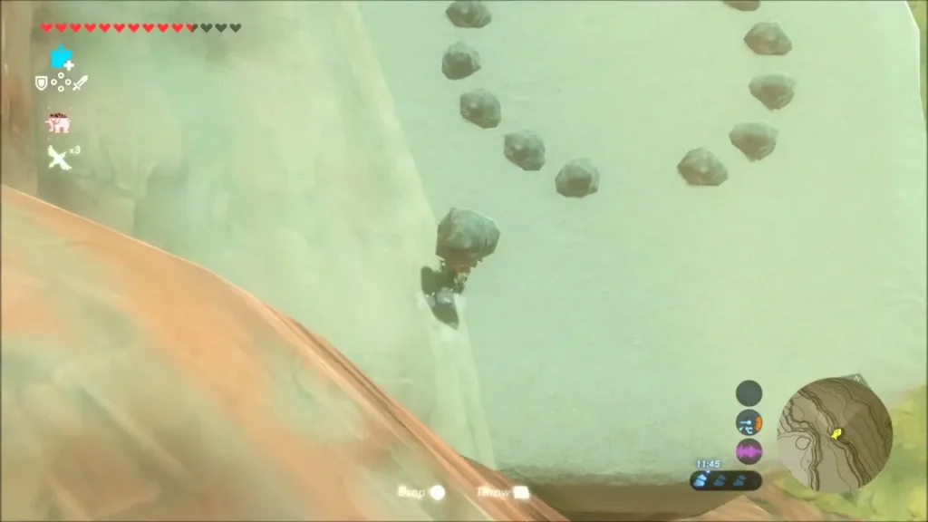 Link climbing with a rock below a ring of stones with one missing Link climbing with a rock below a ring of stones with one missing