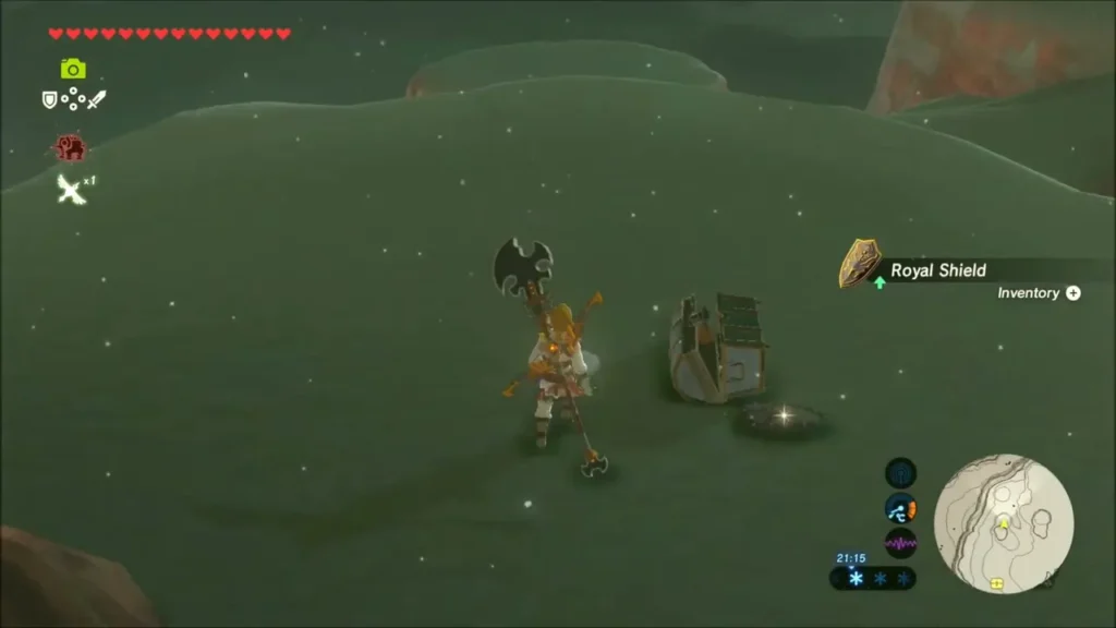 Link beside an opened chest as a Royal Shield is added in the cold fog Link beside an opened chest as a Royal Shield is added in the cold fog