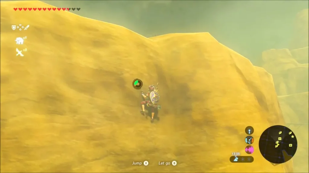 Link climbing the yellow canyon wall toward a ledge Link climbing the yellow canyon wall toward a ledge