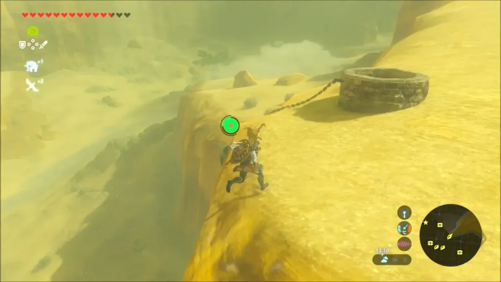 Link on the ledge with a chained round boulder lying beside a stone ring Link on the ledge with a chained round boulder lying beside a stone ring
