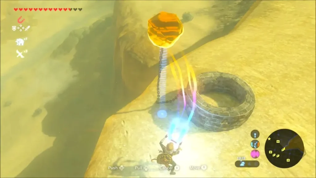 Link using Magnesis to lift the chained boulder over the stone ring Link using Magnesis to lift the chained boulder over the stone ring
