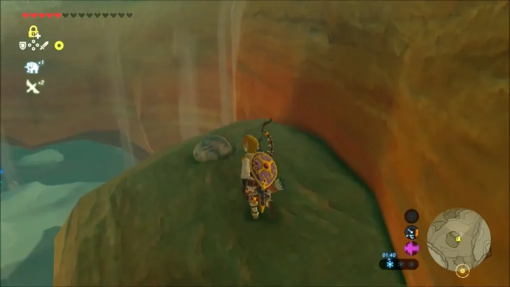 Link standing on the rocky arch beside a boulder above the canyon Link standing on the rocky arch beside a boulder above the canyon
