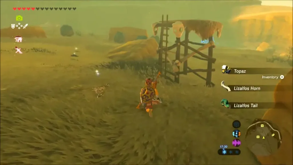 Wooden lookout tower in the desert grass with item pickups on the right Wooden lookout tower in the desert grass with item pickups on the right